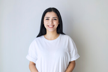 portrait of young happy woman looks in camera