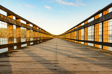Wooden boardwalk walkway the over water ay the Billy Frank Jr Nisqually National Wildlife Refuge...