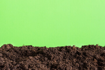 Fertile soil over green background template.