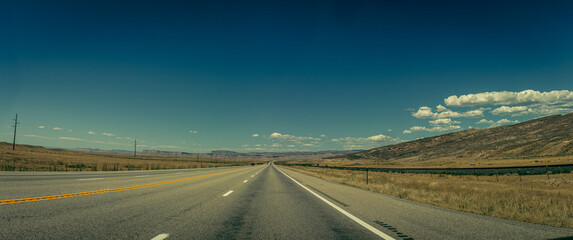 Panorama shot of american straight road in Utah at sunny day