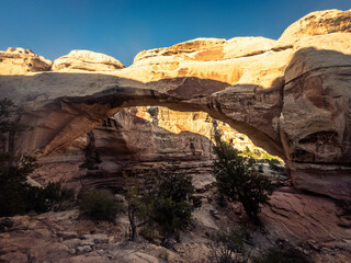 Fototapeta na wymiar Close up of sandstone arch with last sun rays in Capitol Reef national park in Utah, america