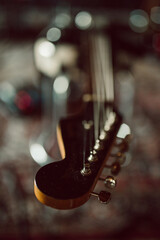 Guitar headstock on professional studio chair
