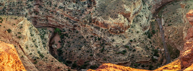 Stream flowing down deep in sandstone canyon in capitol reef national park in Utah, America