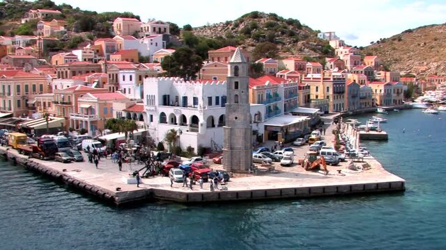 Symi Greece Rhodes is a Greek island It is mountainous and includes the harbor town of Symi and its adjacent upper town Ano Symi, with beautiful neoclassical uniform and colorful houses