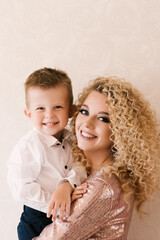 Portrait of a young beautiful mother with her son, happy family