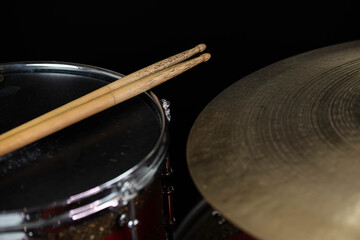 Closeup of drumsticks lying on the professional drum set. Drummer equipment. 