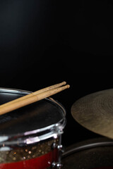 Obraz premium Closeup of drumsticks lying on the professional drum set. Drummer equipment. 