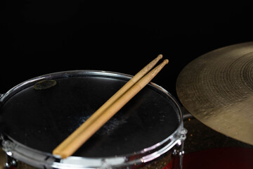 Closeup of drumsticks lying on the professional drum set. Drummer equipment. 