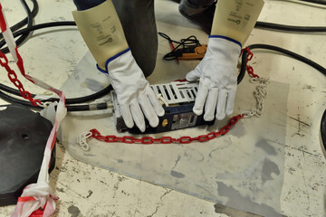 Paterna, Valencia, Spain: 02.18.2021; The electrician working on the floor