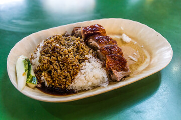 Rice with meat, meal in the Chinatown hawker center in Singapore.