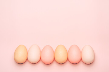 Creative flat lay photo of easter eggs on colorful background.