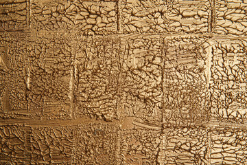 Fototapeta na wymiar Rough gold colored surface. Empty space for text