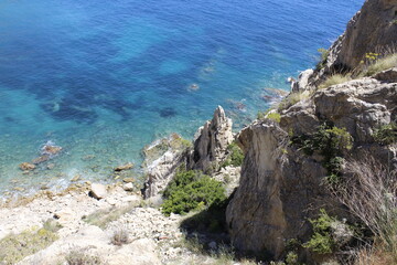 Beautiful views of the sea and the rocks from the top of a mountain.