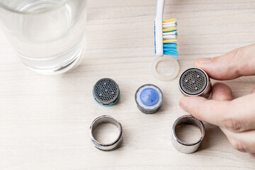 water faucet aerator after cleaning clogged using vinegar. handyman aerator repair