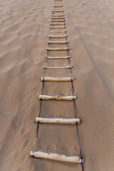 Ropa ladder at Singing Sands Dune near Dunhuang, Gansu Province, China