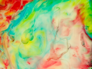 liquid texture of brightly colored paints