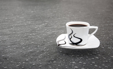 Cup of espresso coffee on ice background