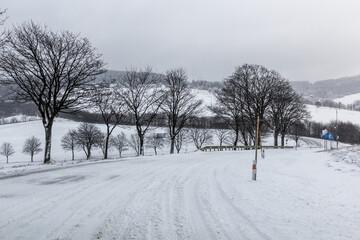 Winter view of I/11 road near Suchy vrch mountain, Czech Republic