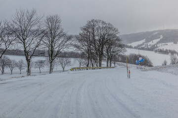 Winter view of I/11 road near Suchy vrch mountain, Czech Republic