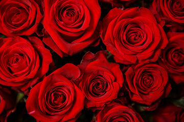 Beautiful bouquet of red roses, seen from above. Spring flowers. Wedding, women's day, mothers day and valentines day background. Selective shallow depth of field.
