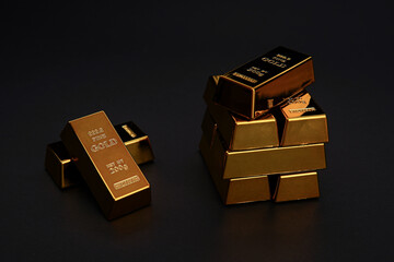 A pile of gold bar a black background. Shiny precious metals for investments or reserves.