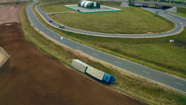 the overturned wagon lies on its side on the Autobahn. View from the copter