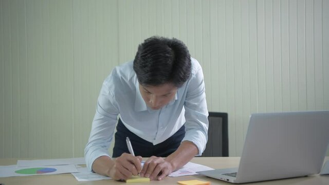 Business concept of 4k Resolution. Asian men are working with a rush in the office.