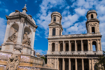 Fototapeta na wymiar View of Saint-Sulpice church. Built in 1754 Eglise Saint-Sulpice is one of the biggest churches in Paris. Saint-Germain-des-Pres district, Place Saint-Sulpice, Paris, France.
