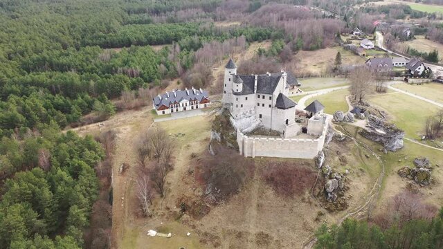 View from drone of renovated medieval royal Bobolice Castle located in Krakow-Czestochowa Upland (Polish Jura) on spring day, Poland