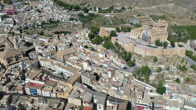 View from drone of historic center of Spanish city of Caravaca de la Cruz overlooking ancient fortified Castle and Basilica of Vera Cruz, region of Murcia