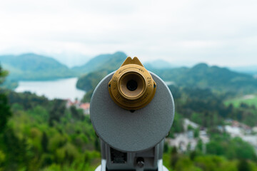 Binoculars looking out to beautiful mountains and lakes