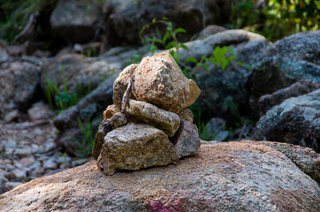 Close-up of a stone man as a marker for hikers on the French island of Corsica