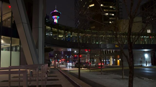 Calgary Alberta Canada, February 18 2021: A time lapse of vehicles commuting under a covered pedestrian walkway in a Canadian city.