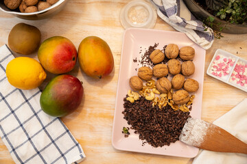 Healthy Food, Mango, Walnuts, Choclate, Chocolate Nips, on wooden background