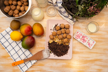 Healthy Food, Mango, Walnuts, Choclate, Chocolate Nips, on wooden background