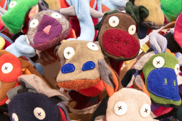 Fototapeta na wymiar Close up of a collection of colourful sock puppets looking at the camera nobody