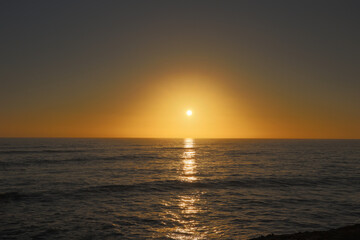 Fototapeta na wymiar A beautiful sunset over the ocean at Sunset Cliffs in California. Magic hour sky.