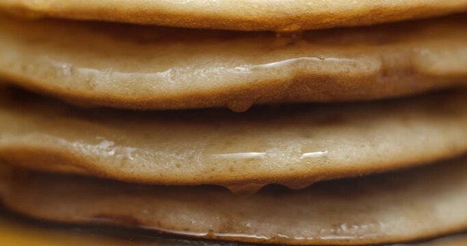Pancakes and maple syrup macro slow motion 4K