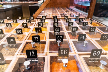 Colorful spices and herbs as a background for design. Various condiments with showcases of...