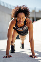 Fototapeta na wymiar Afro athletic woman running outdoors.