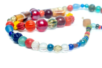 Ancient beads multicolored Thailand isolated on white background.