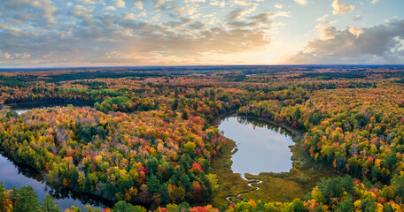 Beautiful autumn sunset over Snipe Lake in the Hiawatha National Forest – Michigan Upper Peninsula – aerial view	