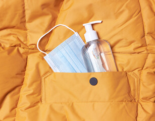 Medical surgical mask and hand sanitizer gel for hand, in a jacket pocket