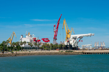 Fototapeta na wymiar Cranes to repair boats in the bay of Cadiz capital, Andalusia. Spain. Europe. February 14, 2021