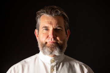Portrait of man in traditional mennonite style of beard with no moustache in studio.
