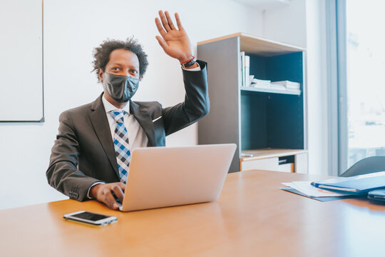 Businessman working with laptop at office.