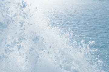 snow splash in the air, blue snow background