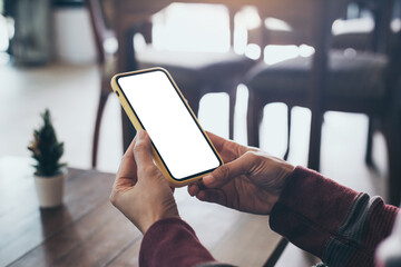 cell phone blank white screen mockup.woman hand holding texting using mobile on desk at office.background empty space for advertise.work people contact marketing business,technology