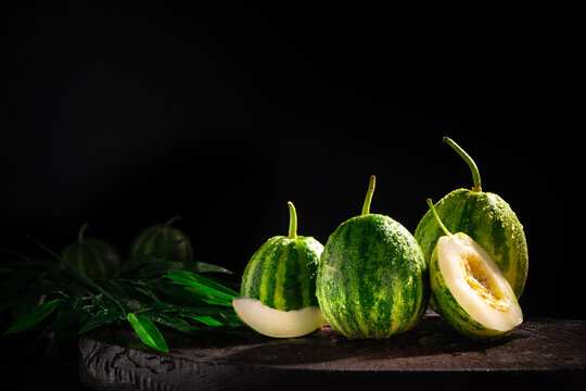 Fresh Green Cantaloupe On A Dark Background