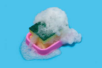 dishwashing sponge with foam on color background